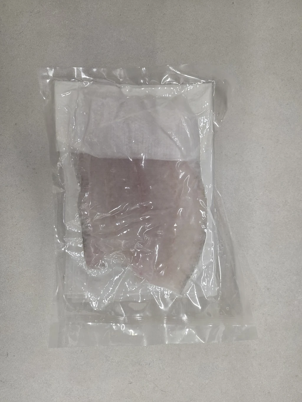 Vacuum-sealed olive flounder sashimi fillet export packshot